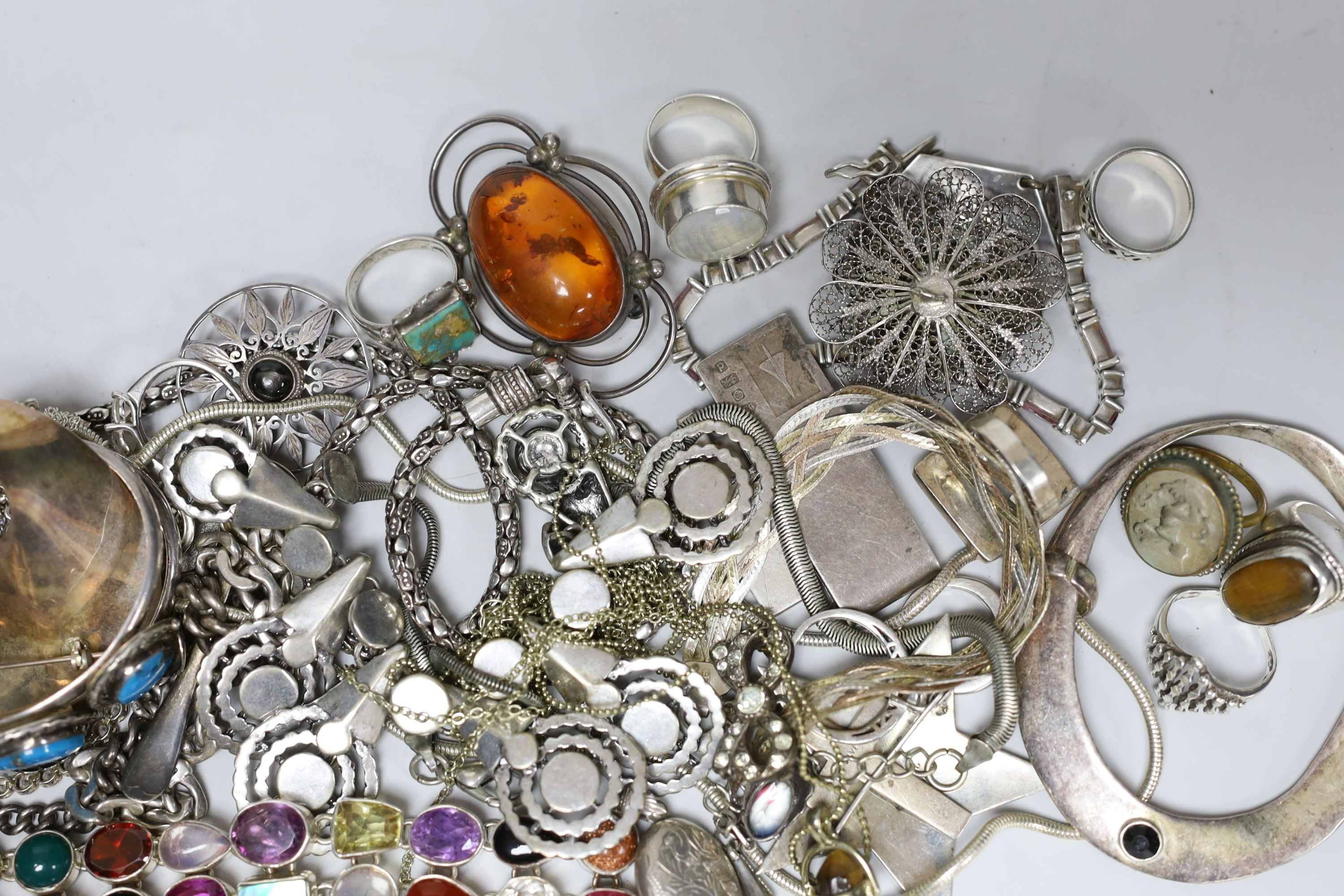 A quantity of assorted silver and white metal jewellery etc. including albert chain with pocket watch, bangles, bracelets, brooches, money clip and rings.